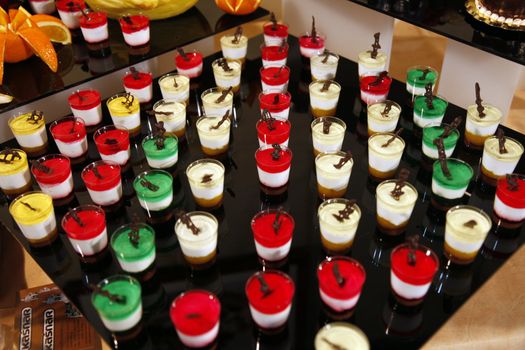 Colorful desserts and pastry served on a wedding party