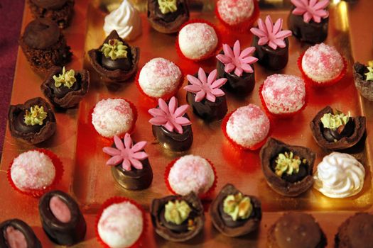 Colorful desserts and pastry served on a wedding party