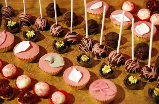 Colorful desserts and pastry served on a wedding party