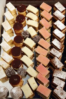 Colorful desserts and pastry served on a wedding party