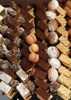 Colorful desserts and pastry served on a wedding party