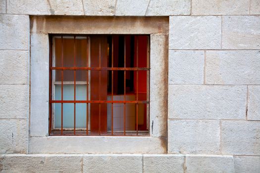 Window of brick building   with grating