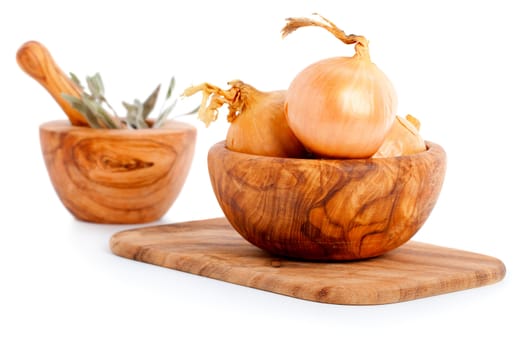 Fresh bulbs of onion on a white background