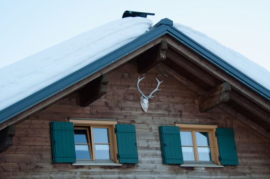 Wooden skiing hut covered with a lot of fresh snow in Montafon, Austria