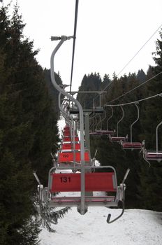 Ski lift chairs in Montafon on a bright winter day
