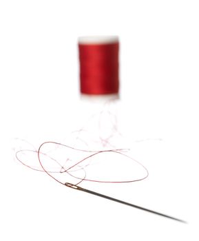 Thread Reel and nedle on white background