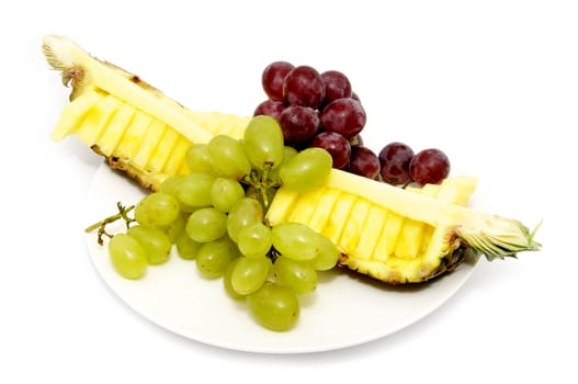 a large plate of sliced fruit on white background