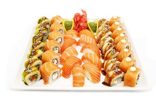 a large plate of Japanese sushi on white background