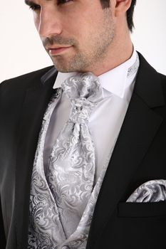 Groom in pose in white background