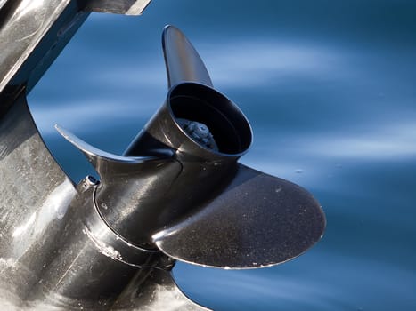 outboard engine propeller on the blue water