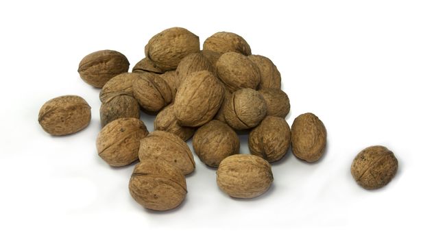 many wallnuts on a white background