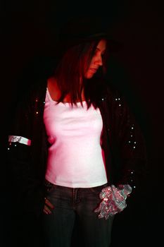 A sad Michael Jackson fan from India wearing the famous 'Billie Jean' sequined jacket and glove, with an armband insribed MJ as a tribute to the superstar.