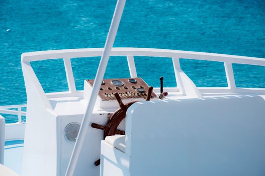 Ship rudder of white yacht on sea background