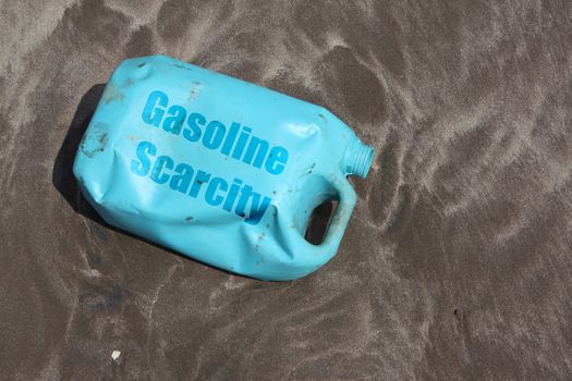 A can of petrol lies empty on the beach sands after gas stations go on strike in India.