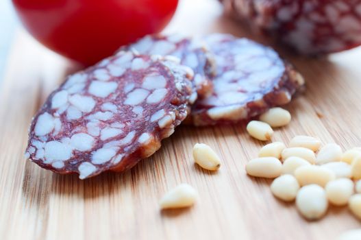 Sausage on a wooden board close up