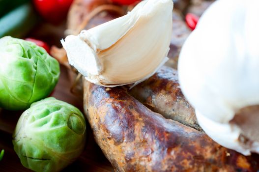 Garlic with sausage and brussels sprouts close up