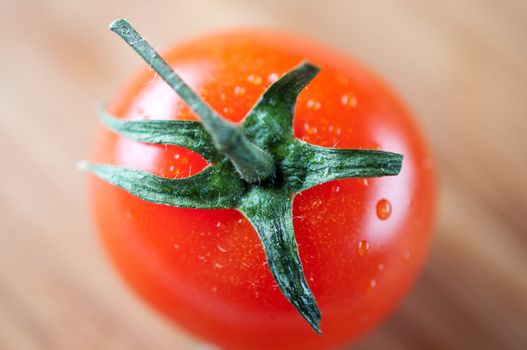 Red cherry tomato on a cutting board