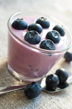 Blueberry yogurt in a glass close up