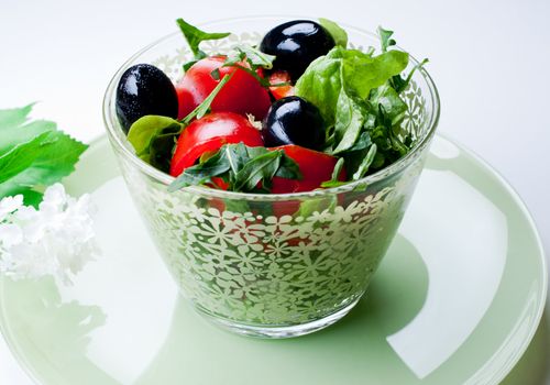 Portion of vegetable salad  in a glass bowl