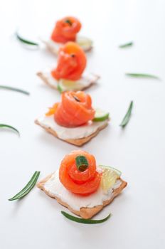 Canapes with smoked salmon and cream cheese on white