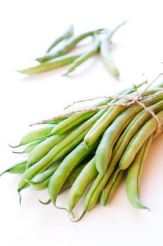 Green beans on white background close up