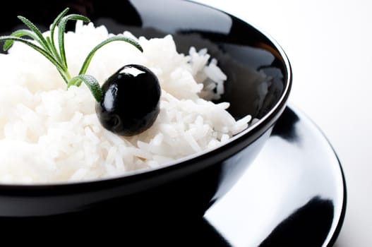 White rice in black bowl close up