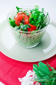 Vegetable salad in a green glass bowl