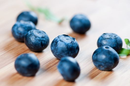 Large blueberries on a wooden board