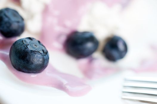 Ripe blueberries in yogurt and cottage cheese
