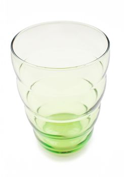 Green glass cup on white background