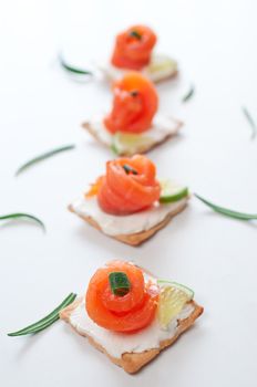 Canapes with smoked salmon and cream cheese on white