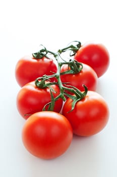 Branch of ripe cherry tomatoes close up