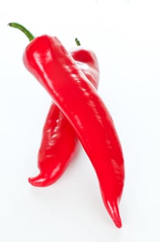 Two paprika peppers on white background close up