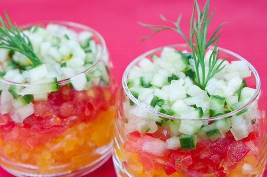 Vegetable salad with cucumber, tomato and yellow pepper close up