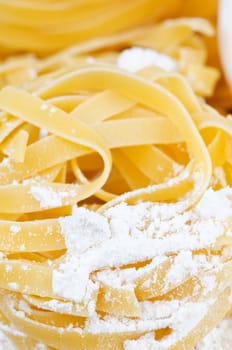 Italian pasta and flour close up