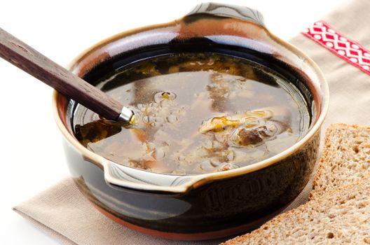 Mushroom soup in brown bowl