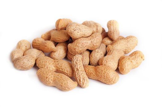 Pile of groundnuts on a white background