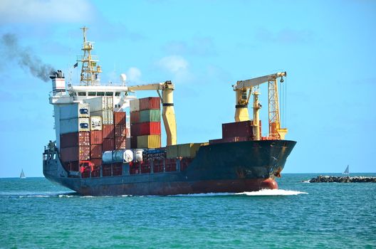 Caribbean based container ship entering the port pf miami