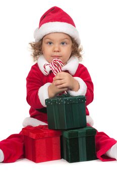 Child with Christmas costume and presents