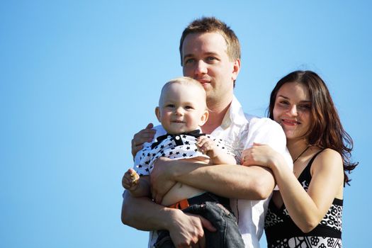 happy family on blue sky background