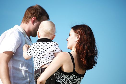 happy family on blue sky background