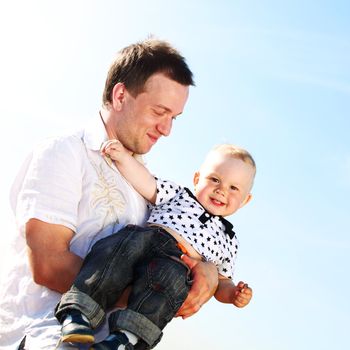 father and take son in blue sky