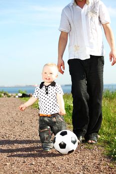 father and son play in soccer