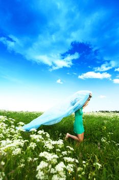  girl run by field fabric in hands fly behind like wings