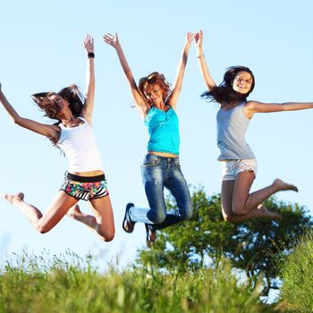 fun smile girlfriends jump to sky