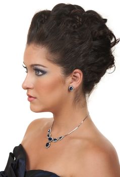 Young woman with beautiful make up, hairdo and sapphire  diamond jewelry