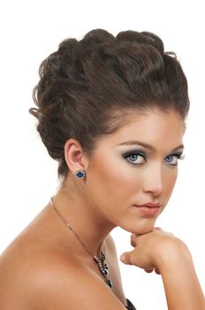 Young woman with beautiful make up, hairdo and sapphire  diamond jewelry