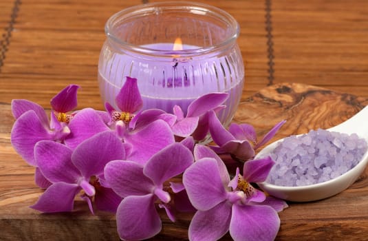 Spa scene with orchid, aromatic candle and bath salt