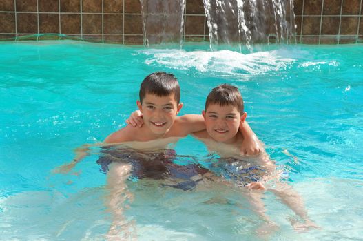 Brothers having fun in the swimming pool