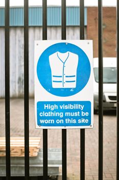 Sign for high visibility clothing at a building site